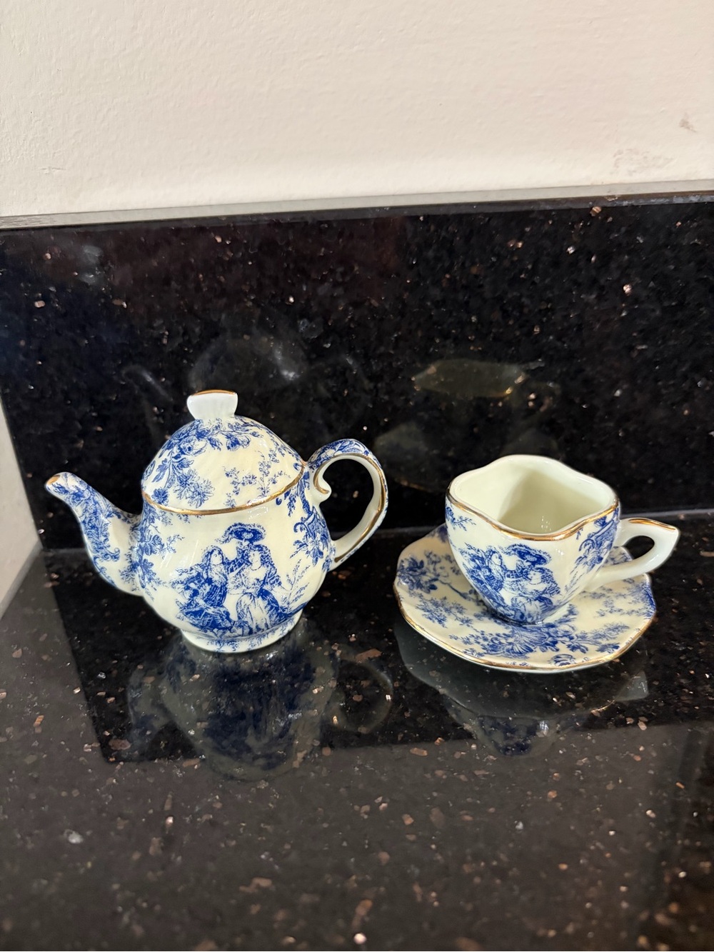 Vintage miniature Blue and White Porcelain Teapot and cup and saucer